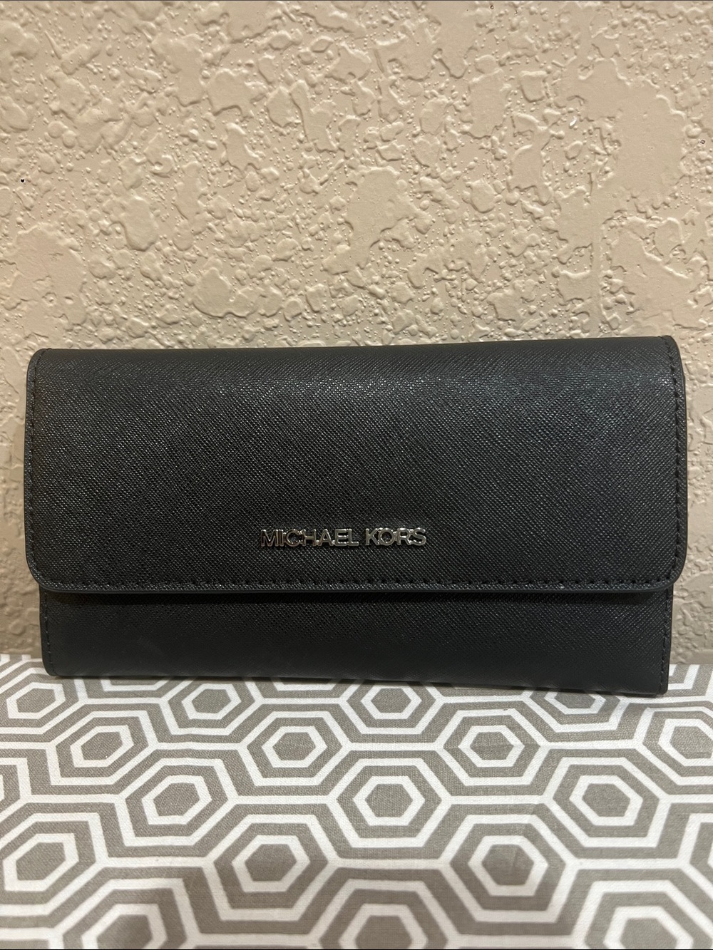 Michael Kors Black jet set travel large trifold wallet. Silver hardware.